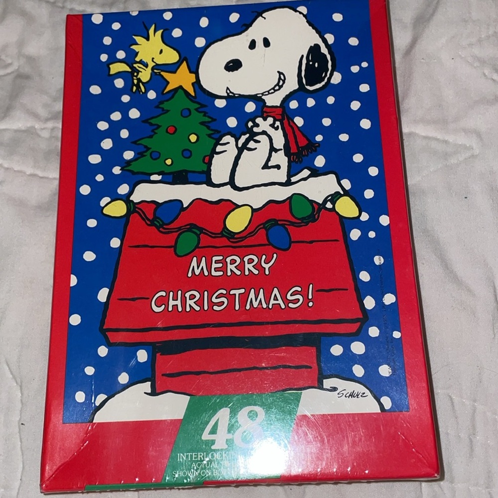 Snoopy’s Christmas! 48 interlocking pieces puzzle. The puzzle is 12”X 17”.